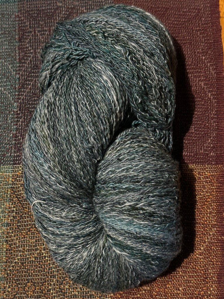 Skein of blue and green hand spun yarn